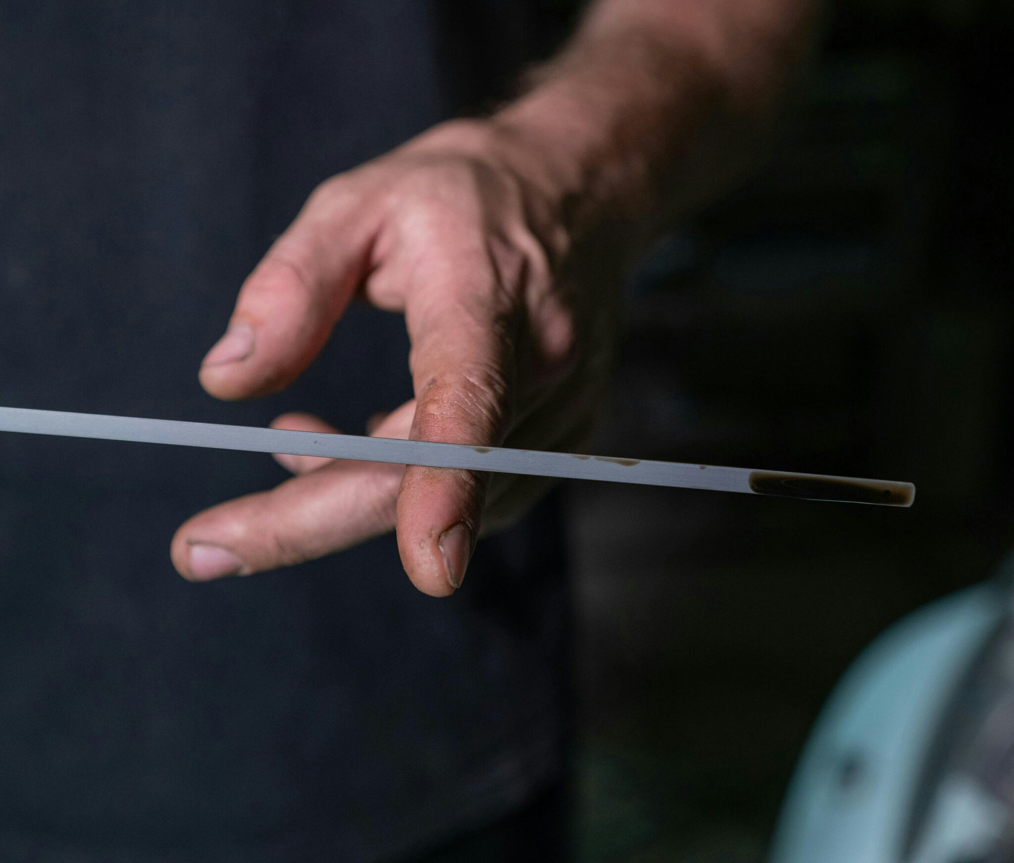 checking engine oil using dipstick before driving