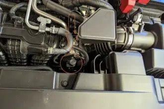 Example of a CVT transmission fluid dipstick in the engine bay. Not all CVT-equipped vehicles have a dipstick.
