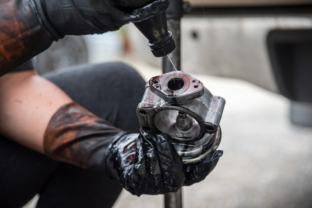 car mechanic doing the cleaning of the egr valve