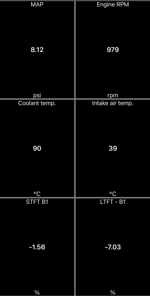 Healthy fuel trim readings at warm idle on a VAG 1.0 TSI engine — STFT -1.56 and LTFT -7.03 on an OBD2 scanner app, no P0171 lean condition