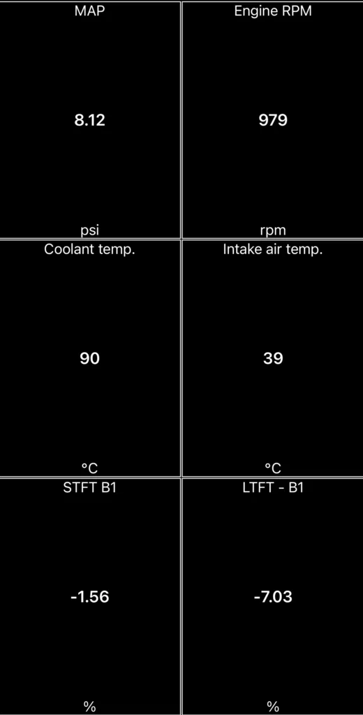 Healthy fuel trim readings at warm idle on a VAG 1.0 TSI engine — STFT -1.56 and LTFT -7.03 on an OBD2 scanner app, no P0171 lean condition